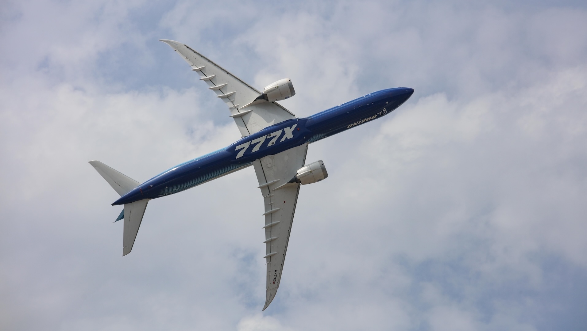Boeing 777X passenger jet in flight with GE9X engines