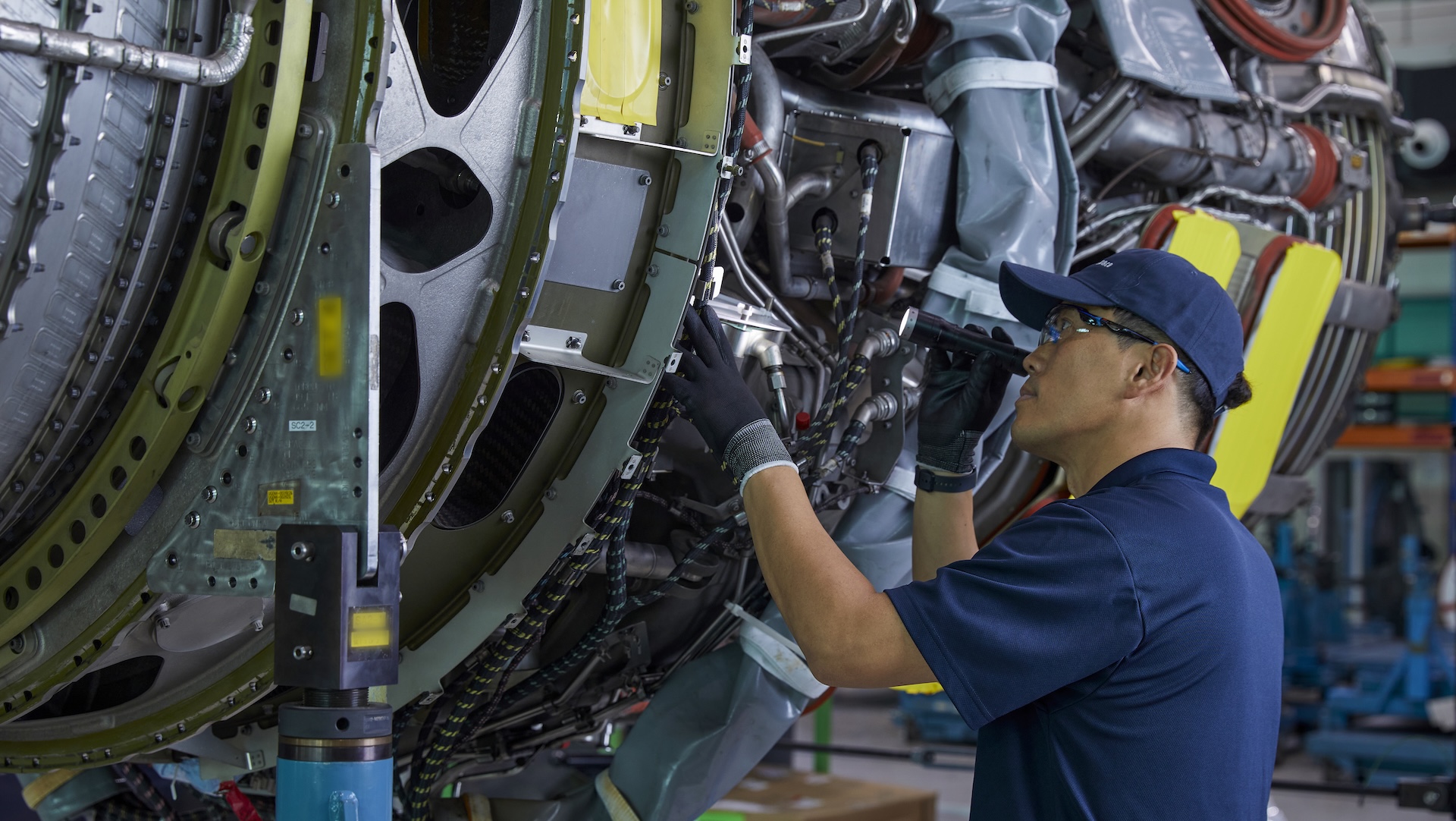 Technician in GE Aerospace's On Wing Support facility in Seoul, South Korea, working on a jet engine