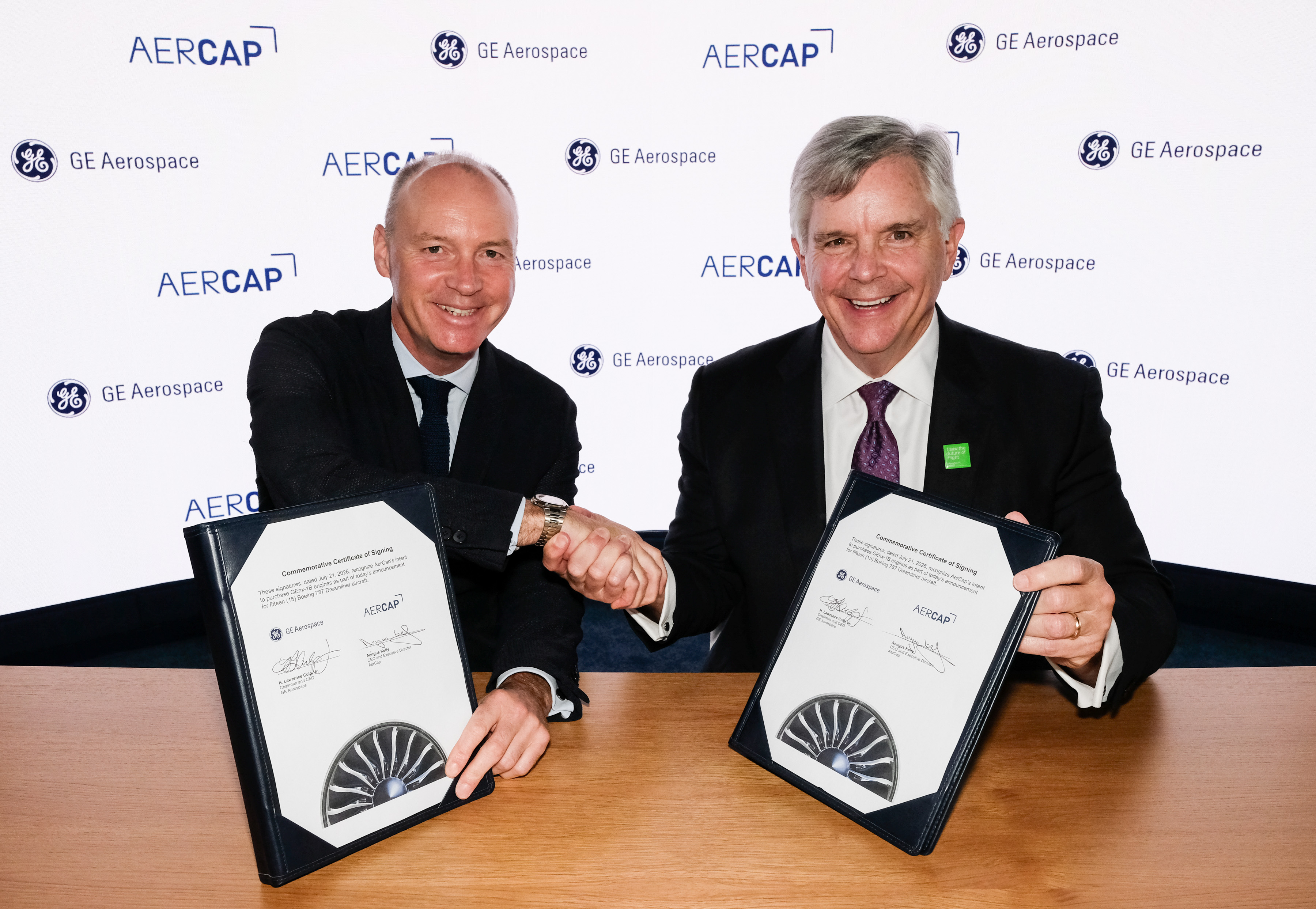 AerCap CEO and Executive Director Aengus Kelly (left) signs a ceremonial...