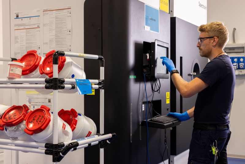 Man touching a screen in a lab