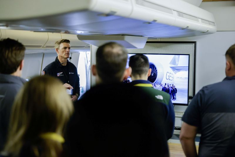 Ohman wearing headset, talking to group inside FTB