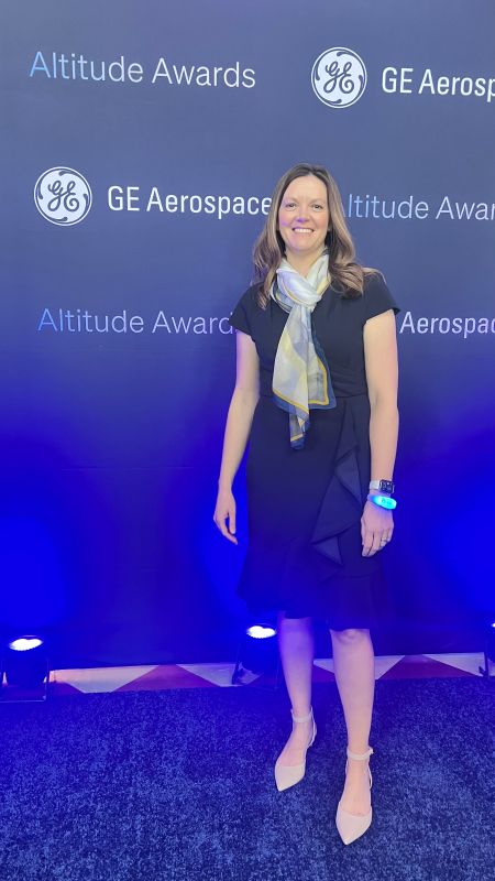Woman standing in front of a background that reads "Altitude Awards"
