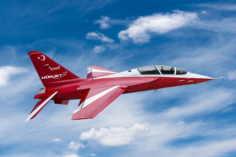 Red plane flying through the sky