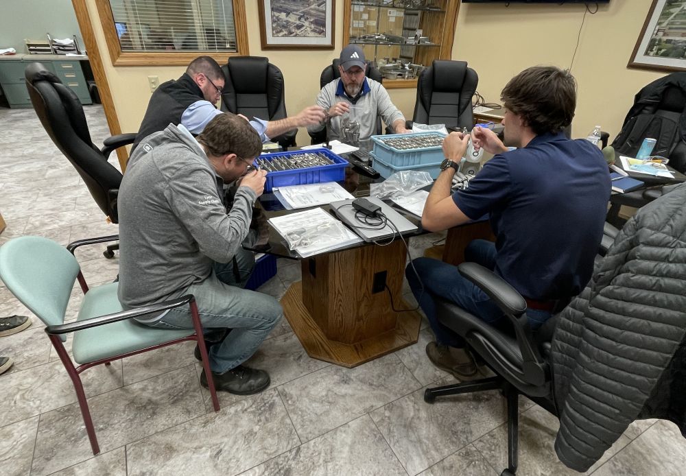 Group gathered around a large wooden table