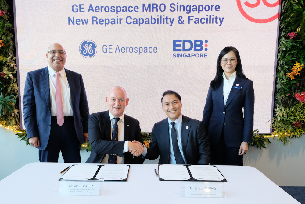 4 people at a signing