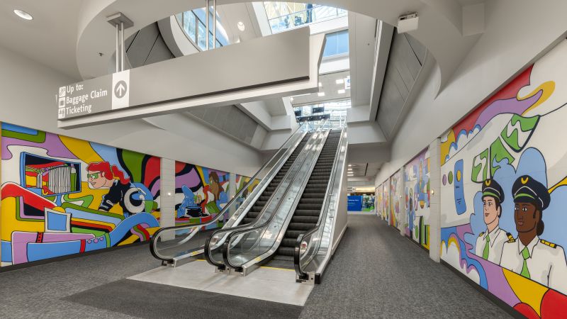 Escalators with murals on both sides