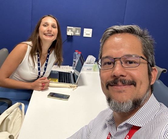 Father and daughter taking a selfie at work