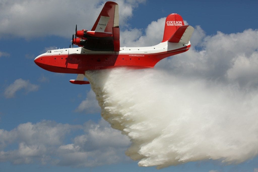 On Monday, the Hawaii Mars dumped 7,200 gallons of water it scooped up from nearby Lake Winnebago on the main runway in front of a stunned crowd.