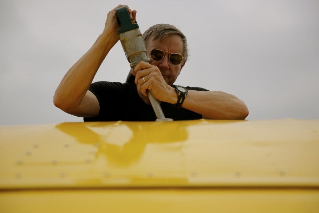 Mottier, gassing up his plane after landing in Oshkosh.