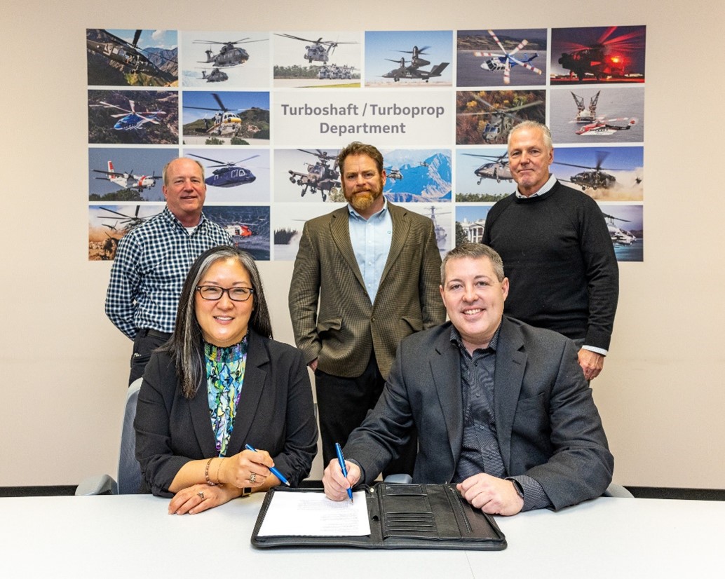 A signing ceremony between GE and Bright Water UAG